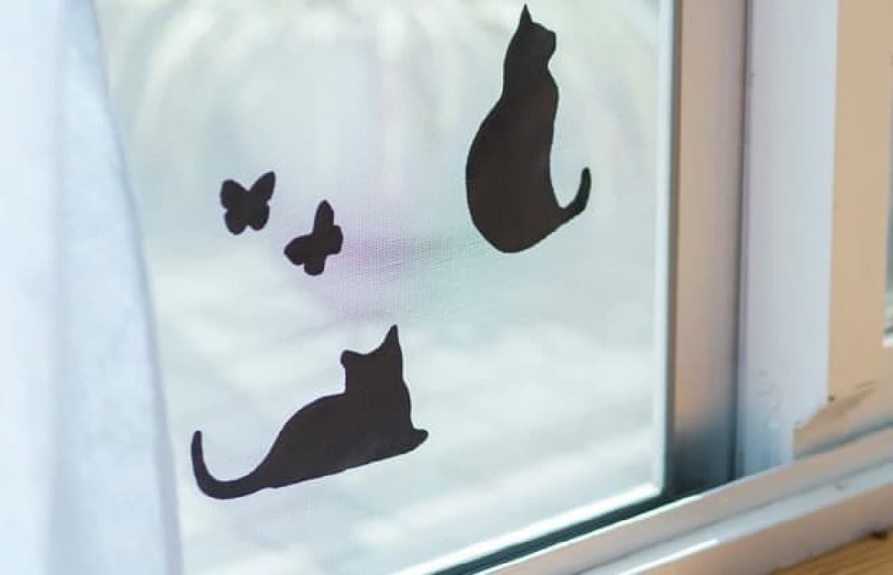"Shadow meow sheet" where cats block perforated screen doors