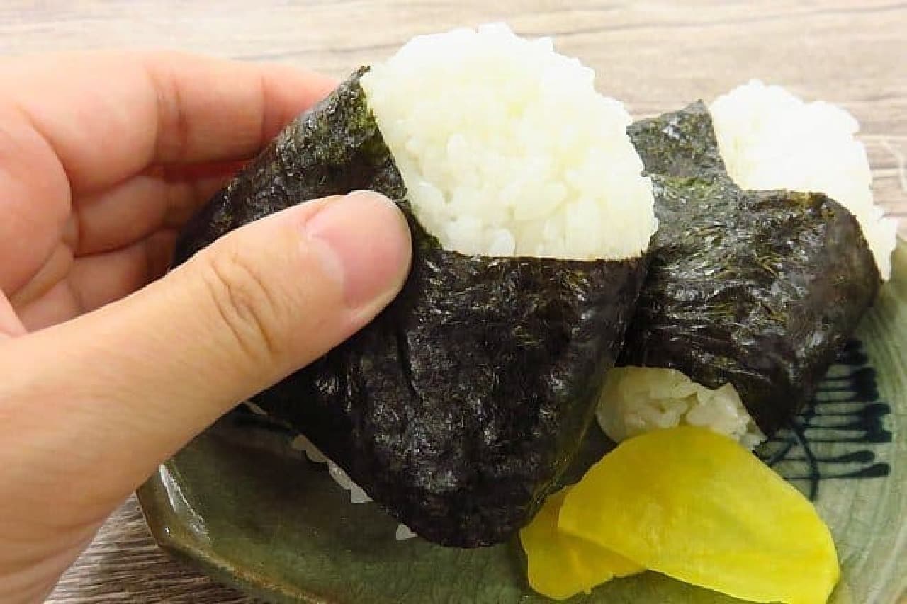 Hand holding a rice ball