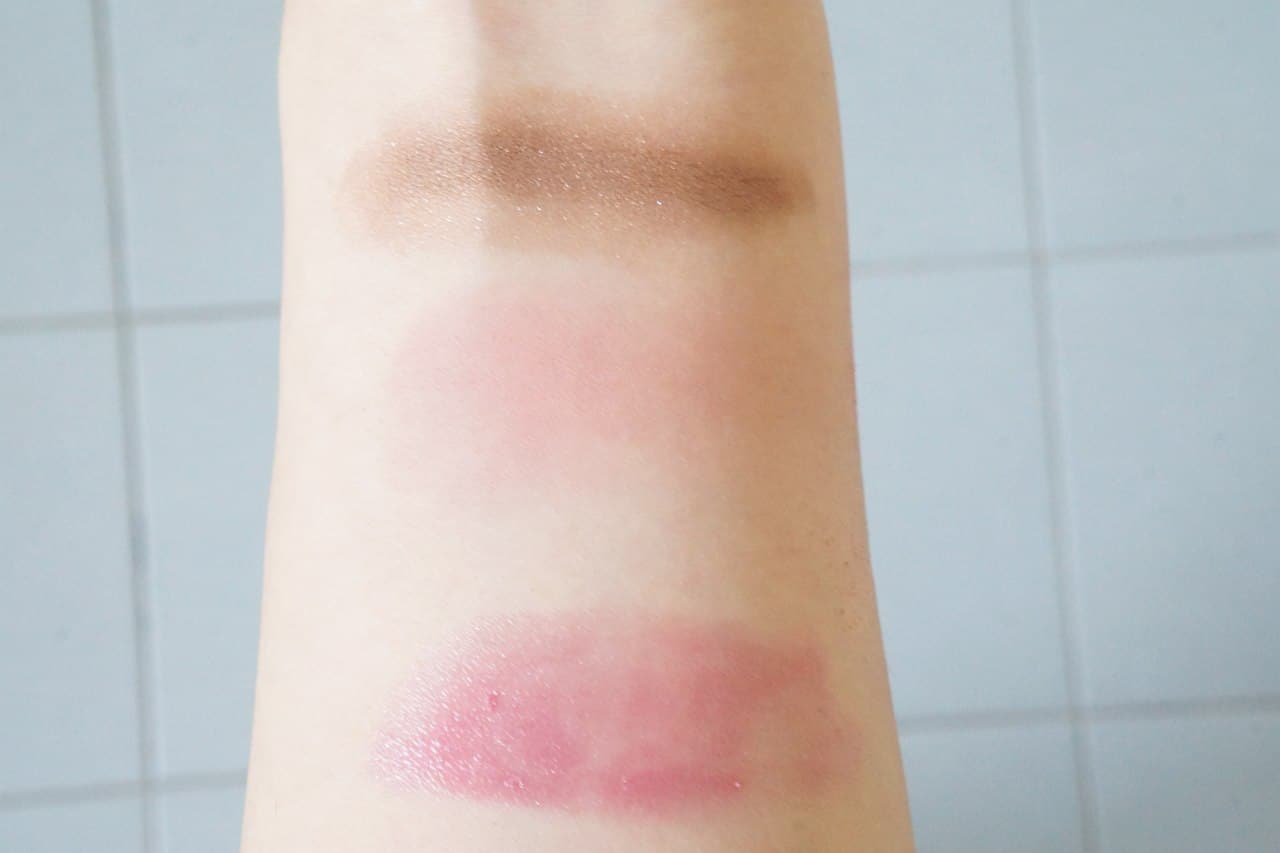 Arms with eyeshadow, blush and lipstick