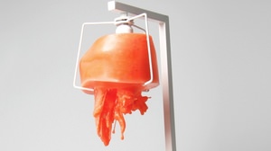 Lampshade "Revitalizer" made of wax that melts and changes shape when lit