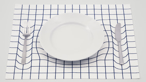 Is it really an optical illusion? Place mat "trick mat" where the table looks dented